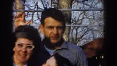 California (1961): Family Standing Together Waving And Smiling While Mother Holds