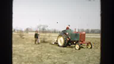 Wisconsin Dells Wisconsin-1954: Man Operating Tractor With Family Watching