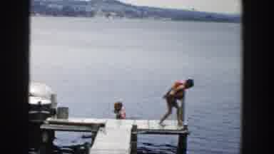 Wisconsin Dells Wisconsin (1954): A Man And Two Boys Walk On A Wooden Dock That