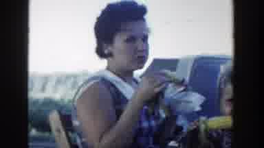 Wisconsin Dells Wisconsin (1954): Woman And A Child Eating Corn The Woman Starts