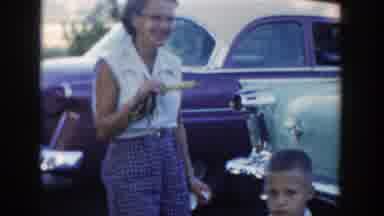 Wisconsin Dells Wisconsin (1954): Woman Smiles At The Camera While Holding An