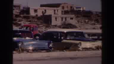 Texas (1958): Old American Cars Parked In Front Of Buildings In A Desert
