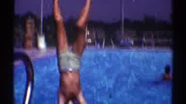 Nevada (1969): Old Video Of Males Diving Or Jumping Into A Pool During Summertime
