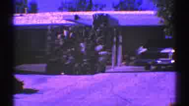 Nevada (1969): A Car In A Driveway In Front Of A Home Under An Awning