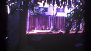 Nevada (1969): View Of Red Wooden Deck And Green Trees On A Sunny Day