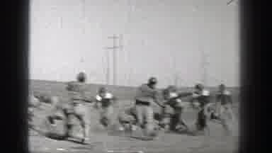 Washington (1938): View Of Football Play In Dirt Field On A Sunny Day