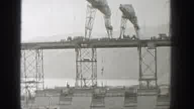 Washington (1938): Two Cranes On Top Of A Bridge Under Construction Lowering Hook