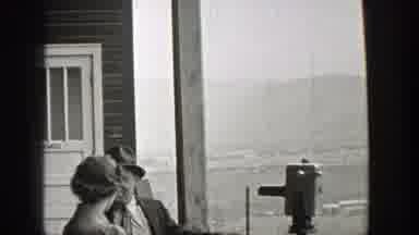 Washington (1938): Couple Views Landscape Through Binoculars