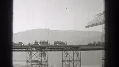 Washington (1938): A Black And White Film Of Trains Traveling Over A Tall Bridge