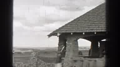 Washington (1938): Person Sitting In A Covered Picnic Area A Mesa And Water