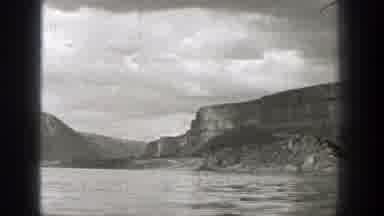 Washington (1938): Open Water With Some Mountains In The Distance Clouds Overhead