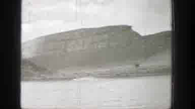 Washington (1938): Jet Ski Going Across Rippling Lake In Front Of Mountains