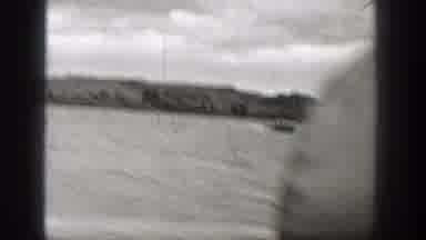 Washington (1938): Black And White Footage Of A Speedboat Speeding On A Lake