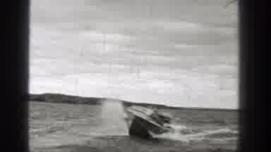 Washington (1938): Motorboat Driving Quickly On A Lake Surrounded By Hilly Terrain