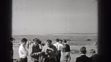 Washington (1938): Group Of Well Dressed People Watch Biplane Fly Loops In Empty