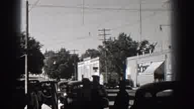 Washington (1938): Suited Men Walk Around Populated Urban Center Near Street Cars