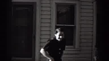 Washington (1938): Man Wearing White Shirt Walks Away From Tree On A Bright Sunny