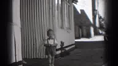 Washington (1938): Little Boy And His Mother Standing Outside Near A Building