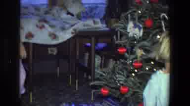 Saint Paul Minnesota (1971): A Child Sitting Under A Christmas Tree Looking At The