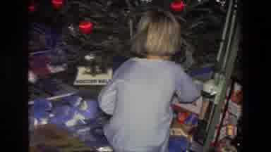 Saint Paul Minnesota (1971): Two Kids Wearing Pajamas Examine Toys And Gifts