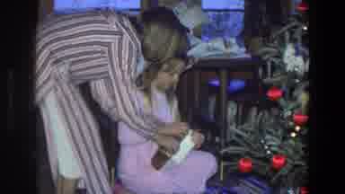 Saint Paul Minnesota (1971): A Girl Struggles To Open A Christmas Present And