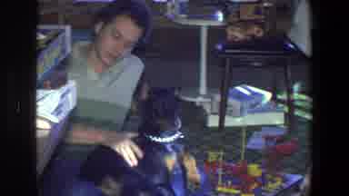 Saint Paul Minnesota (1971): Man Pets His Doberman Dog Sitting In His Living Room