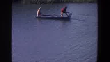 Saint Paul Minnesota (1971): Two Men In A Boat Trying To Start Motor