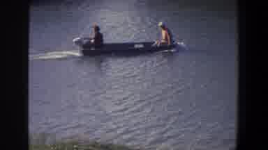 Saint Paul Minnesota (1971): Two People Riding In Grey Motorboat On A Sunny Day