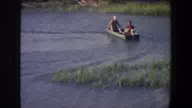 Saint Paul Minnesota (1971): People In A Small Boat On The Water With A Broken