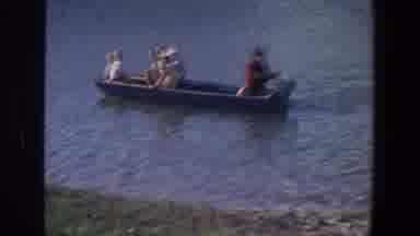 Saint Paul Minnesota (1971): Four People Ride In Boat While Woman Stands In Water