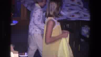 Saint Paul Minnesota (1971): Girl Wearing Yellow Dress Picks Up Yellow And White