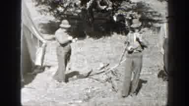California (1938): People Living In A Tent Are Guiding A Horse Away