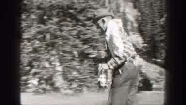 California (1938): Outdoors men Share Goods While Horse Rider Sits On Saddle In