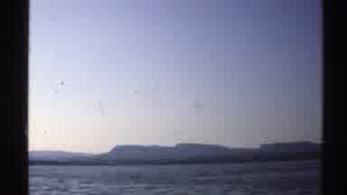 Norway (1976): Open Water With Soft Light And Mountainous Background