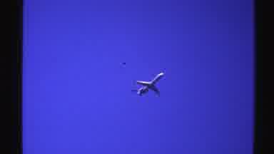 Norway (1976): A Video Of An Airplane Flying High In A Very Blue Sky