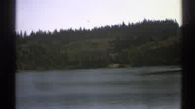 Norway (1976): A View From The Road In Movement A Lake Surrounded By Trees