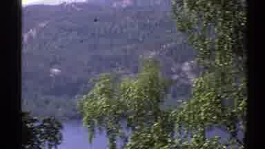 Norway (1976): A Hillside Lake Peeking Through Flowing And Sweeping Foliage And