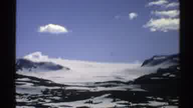 Norway-1976: Closeup Of Partly Snow Covered Mountain Top On A Sunny Day With