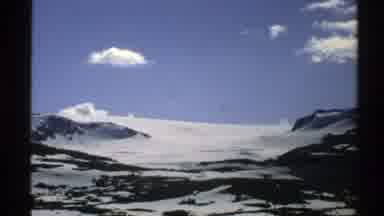 Norway (1976): Snow-Capped Mountains And Blue Sky With Very Little Cloud Cover