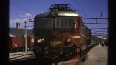 Norway (1976): View Of Brown And Gold Train Engine On A Sunny Day