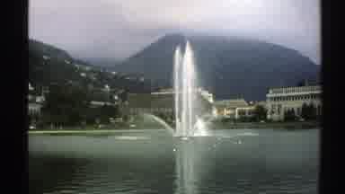 Norway (1976): View Of Water Fountain And White Building On A Clear Day