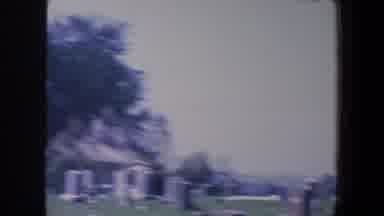 Iowa (1959): A Cloudy Day In The Cemetery With Several Equal Tombs And Ashes
