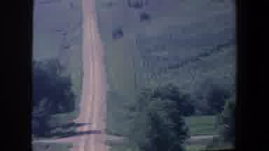 Iowa (1959): One Long Dirt Stretch Of Road Going With Lots Of Greenery Around No