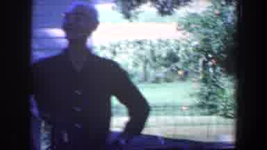 Iowa (1959): Senior Citizen Interacts With A Skunk Climbing A Tree