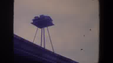 Iowa (1959): Small Suspended Birdhouse On The Roof