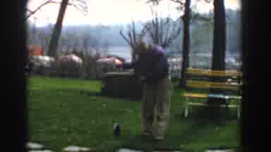 Novi Michigan (1961): Man Wearing Blue Shirt Drags Fish On Fishing line On Ground