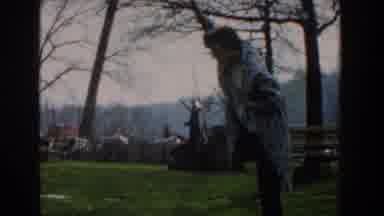 Novi Michigan (1961): Woman Standing Over A Fish On A Line And People On A Dock