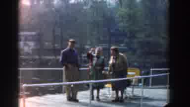 Novi Michigan (1961): A Man And Women Fishing And A Woman Gardening
