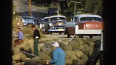 Wisconsin (1957): Camera Pans Across Landscape People Fishing On Rocks And A Line