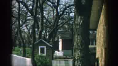 Wisconsin (1957): House People Talk Play Mom Educate Son Backyard Family Together